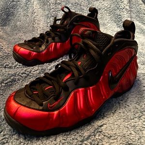 Nike basketball shoe. Red with black trim.